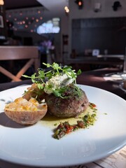 Gourmet Meat Patty with Stuffed Potatoes and Herb Sauce