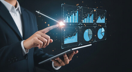 Businessman analyzing financial data on futuristic holographic display with tablet
