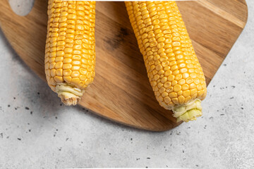 corn cobs on a light background, fresh corn