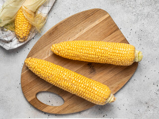 corn cobs on a light background, fresh corn