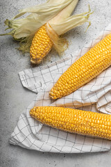corn cobs on a light background, fresh corn