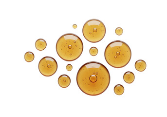 Obraz premium Abstract pattern of golden amber liquid bubbles and drops isolated on transparent background