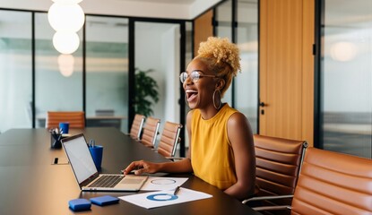 Young businesswoman working on laptop in office