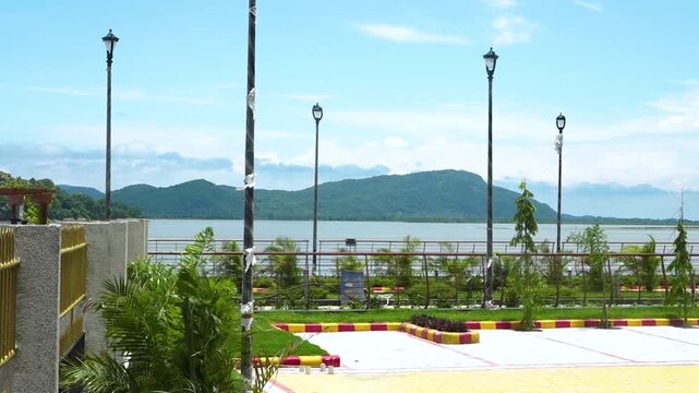 Scenic Park View with Lake and Hills in Background &ndash; 4K Relaxing Nature Footage