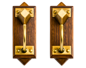 Pair of vintage-style brass door handles on wooden backplates on a transparent background