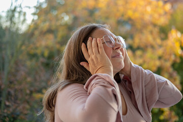50-year-old woman experiencing hot flashes due to menopause and high blood pressure, high blood...
