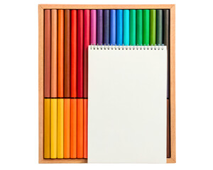 Wooden box of colored pencils with a blank spiral notebook on a transparent background