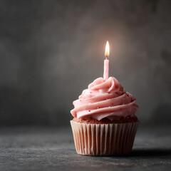 Single Cupcake with Pink Frosting and Candle on Dark Background