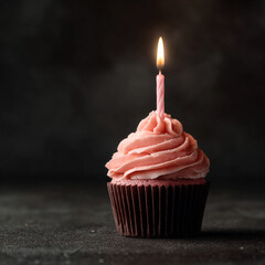 Single Cupcake with Pink Frosting and Candle on Dark Background