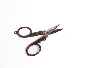 small rusty scissors full of dust isolated white background