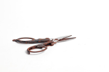 small rusty scissors full of dust isolated white background