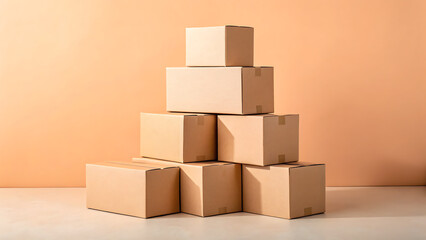 Obraz premium Stack of cardboard boxes ready for shipping or storage against a warm orange background