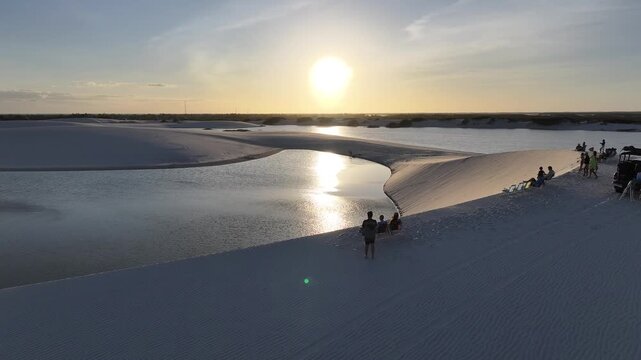 Sunset Lencois Maranhenses In Santo Amaro Maranhao Brazil. Natural Freshwater Lagoon Nestled Between White Sand Dunes. Sunrise Sky Beach Sea. Sunrise Outdoor Panorama. Santo Amaro Maranhao.