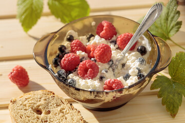 Ricotta or cottage cheese with fresh raspberries and  black currant.