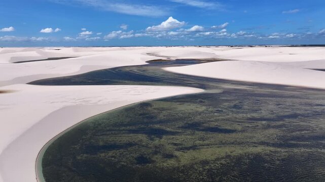 Lencois Maranhenses Skyline In Santo Amaro Maranhao Brazil. Unique Landscape Of White Sand Dunes And Crystal-Clear Lagoons. Coast Clouds Seaside Summertime. Coast Outdoor Panorama.