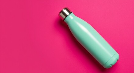 Stylish reusable water bottle on a vibrant pink background, perfect for staying hydrated in an eco-friendly way and reducing plastic waste.