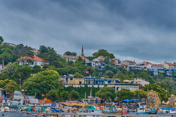 View of the city and pier with boats on the shores of the Black Sea in Sile