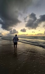 Walking on the beach at sunset