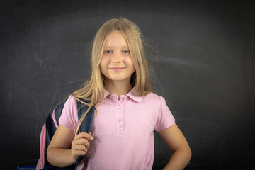 Smiling student girl carrying backpack