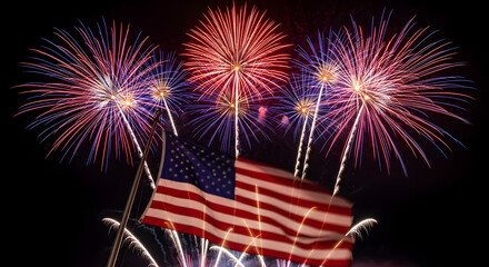 the night sky above a waving American flag, celebrating USA's Independence Day. The vibrant display of light and color evokes a sense of patriotism and national pride.