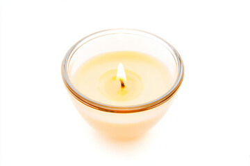 a candle is lit in a glass on a white surface