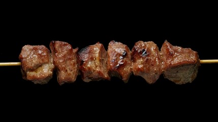 Grilled meat skewers with herbs and spices served on dark rustic background, top view of juicy shish kebab arranged with vegetables and seasoning for barbecue or party meal




