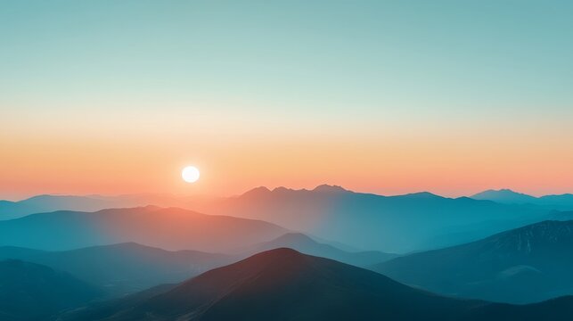 A peaceful sunset casts a warm, golden glow over a mountain range with layers of hills fading into the distance. Sky transitions from a soft orange to a calming blue, creating a tranquil landscape