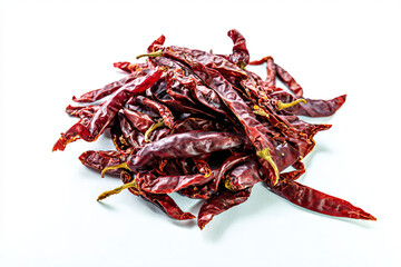 a pile of dried red chili peppers on a white surface