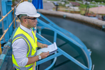 Environmental engineers work at wastewater treatment plants,Water supply engineering working at...