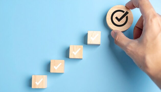 Hand placing final large check marked block in diagonal sequence, symbolizing milestone completion