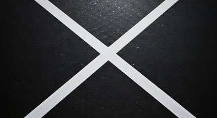 White Painted Cross on Black Asphalt Surface 1.