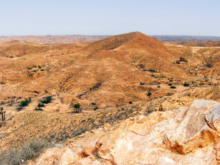 Quiet immensity of Tunisia’s pre-Sahara — ochre rocks and scorched hills mark the threshold between dry earth and desert myth. Silence lives in every grain of dust.