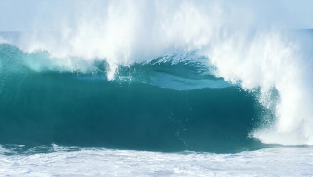 The large waves were most likely strong ocean waves or even tsunami waves and produced a lot of white foam