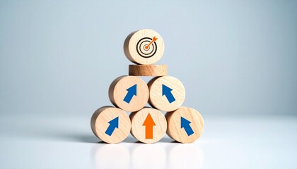 Wooden block pyramid with upward arrows leading to target icon at top, symbolizing goal achievement and strategic progress