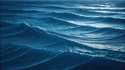 Waves rolling gently across the ocean blue