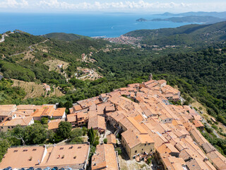 Aerial view of the historic center of Marciana and a panorama of the bay of Marciana Marina on the island of Elba, Livorno