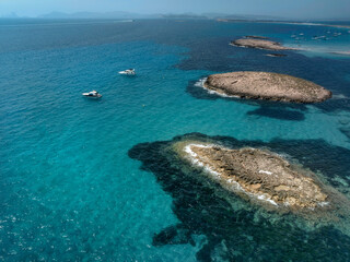 The aerial view over turquoise waters of Formentera island