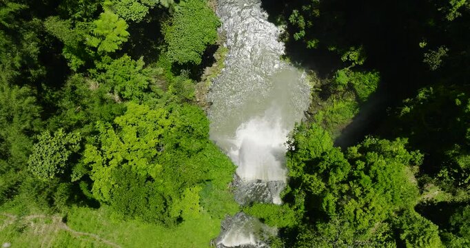 Top view over the Hikong Alo Falls surrounded by mountain jungle, rainforest and green trees. Lake Sebu. Mindanao, Philippines.