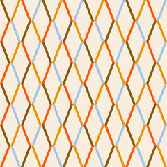 Geometric rhombus seamless pattern in blue, orange, green and yellow colours on a light background . Vector diamond background.
