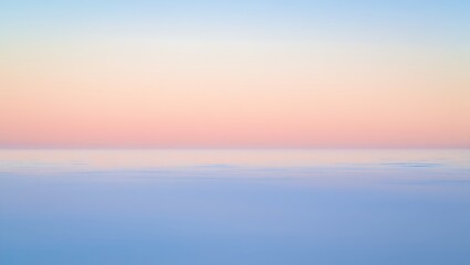 Obraz premium Serene abstract horizon where a pastel sky in soft blue and peach meets a tranquil rippled calm body of water