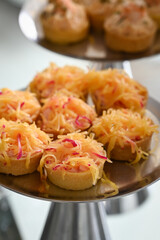 kingdom cheese mini quiches, savory cheese tarts on platter, elegant brazilian event appetizers, mini quiches