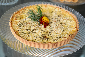 cheese quiche, gourmet charcuterie and cheese board, elegant appetizer platter with fruit, sophisticated rustic catering display