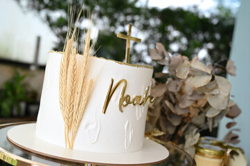 christening cake, cake with the name "Noah", elegant 'noah' christening cake, golden cross baptism cake, first communion celebration dessert

