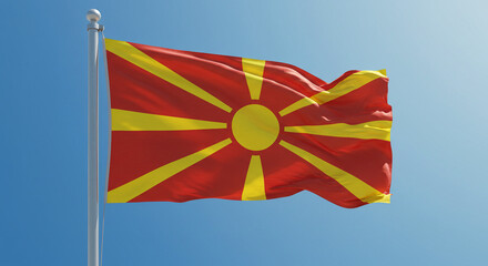 The flag of North Macedonia fluttering calmly in the morning wind, centered against a clear sky.