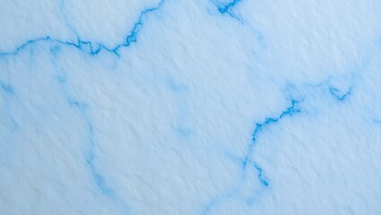 Obraz premium Clean White Surface with Vibrant Blue Veins Resembling Cracked Ice or Stone