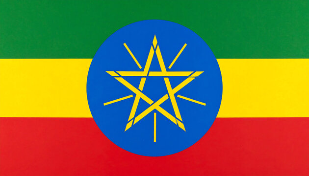 Ethiopian tricolor flag—green-yellow-red stripes with blue disc and radiant yellow star