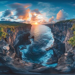 Vibrant sunset over cliffs by the ocean, creating a serene landscape.