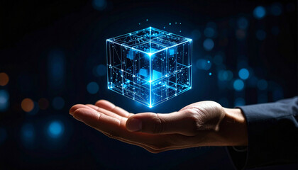 Open palm holding glowing data cube with floating particles in dark background