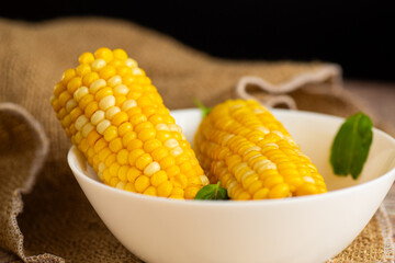 corn cobs with greenery on the table