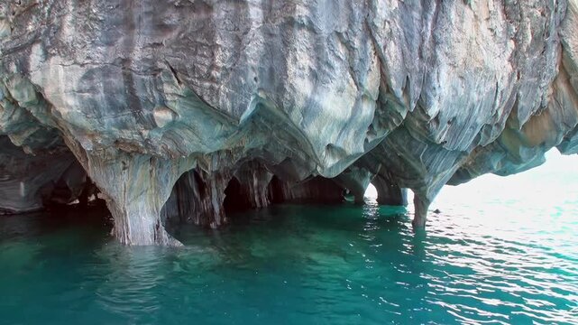 Glide across the turquoise waters into the incredible Marble Caves of Chile Chico, Chile. See the smooth, swirling patterns of the rock formations in the fading sunlight.